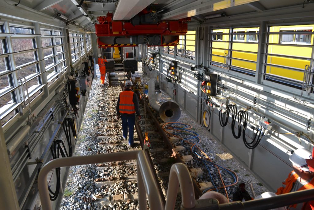 Workers inside the mobile maintenance train - the workshop on wheels