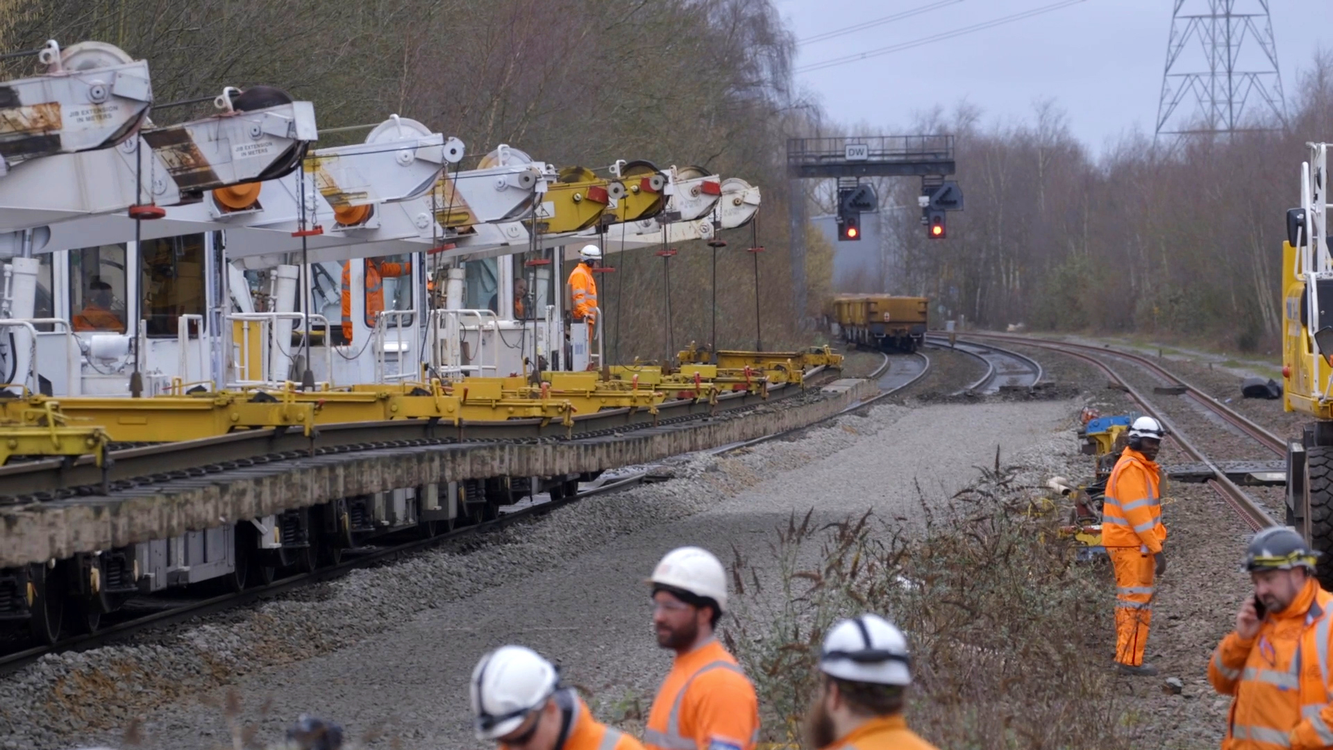 Engineers adjacent to track removal machines 