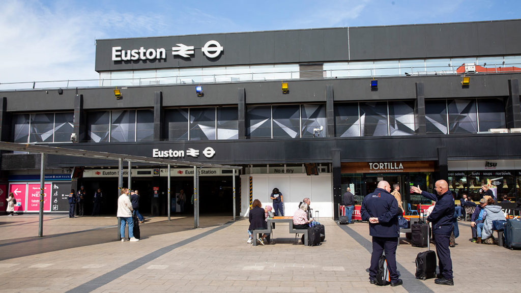 The front entrance to London Euston on a sunny day.