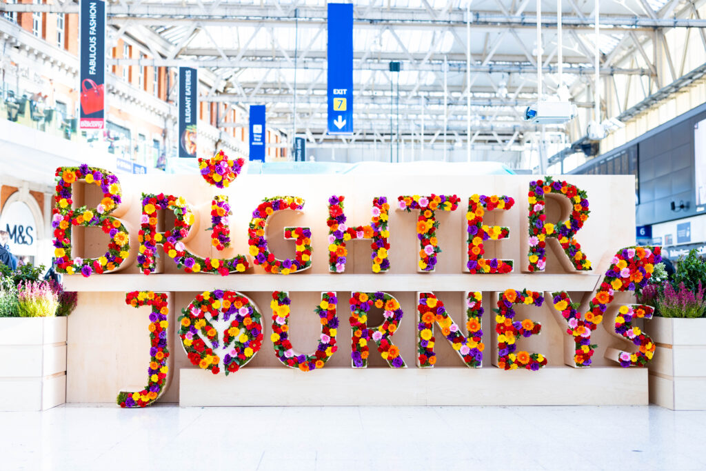 Brighter Journeys flower/sensory installation in station concourse.