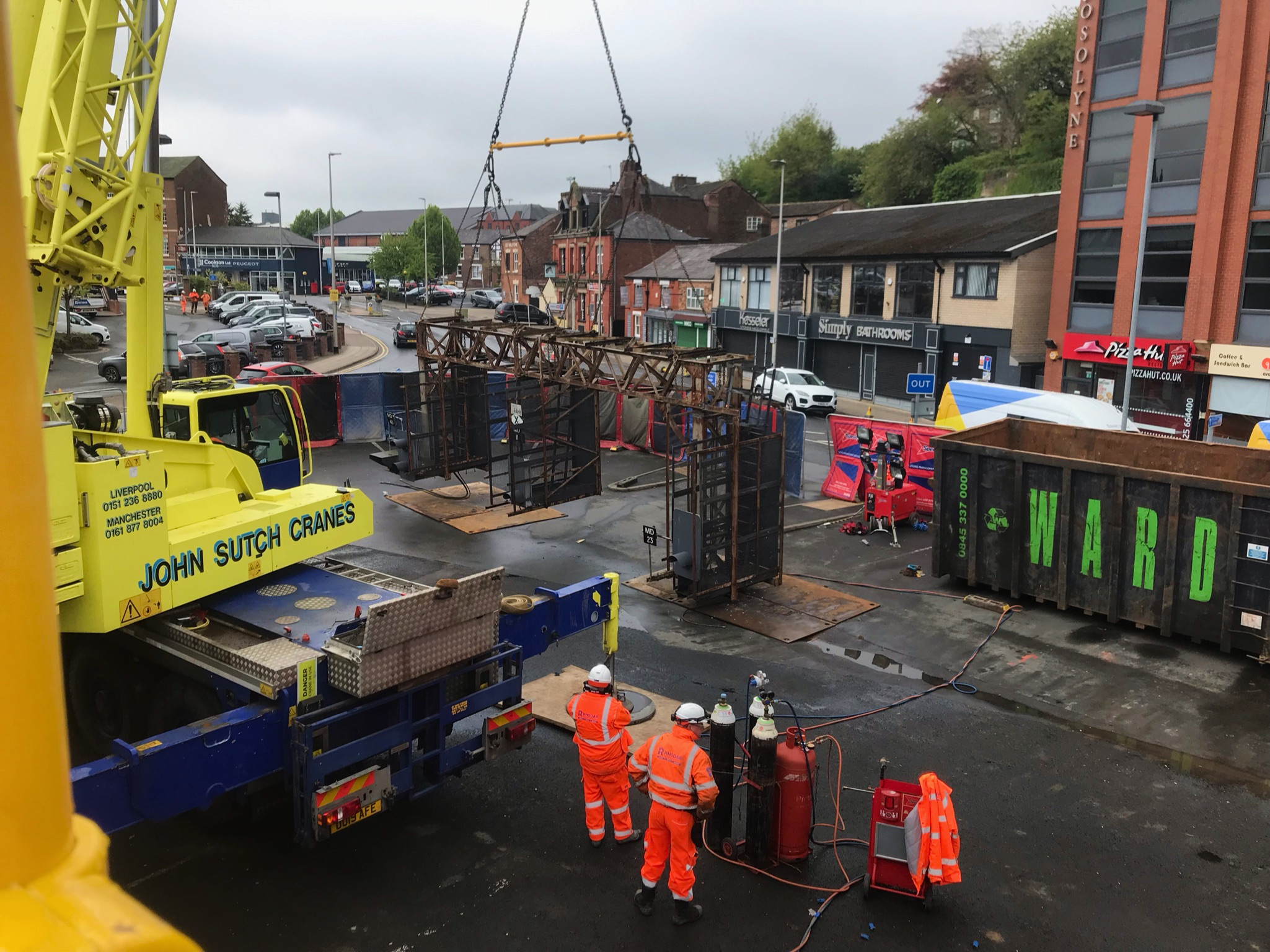 Crane lifting out old signal gantry in Macclesfield. 