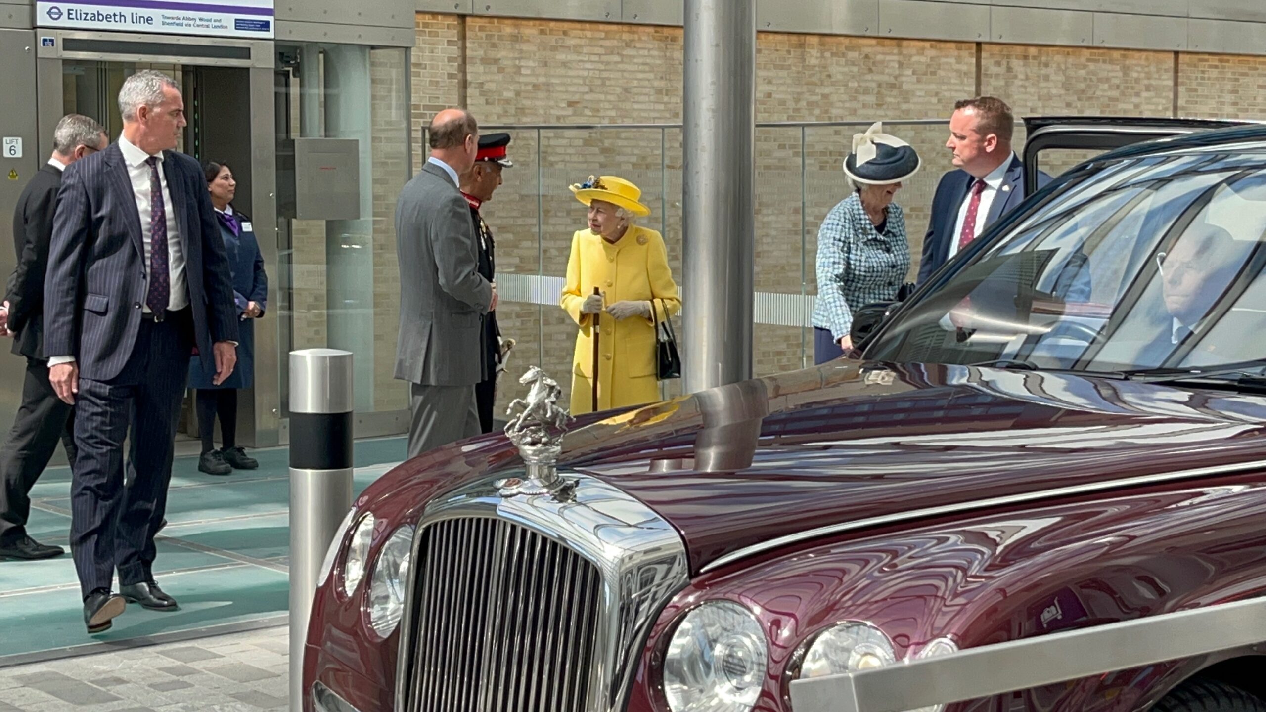 Her Majesty The Queen at London Paddington talking to escort and celebrating the completion of the Elizabeth Line.