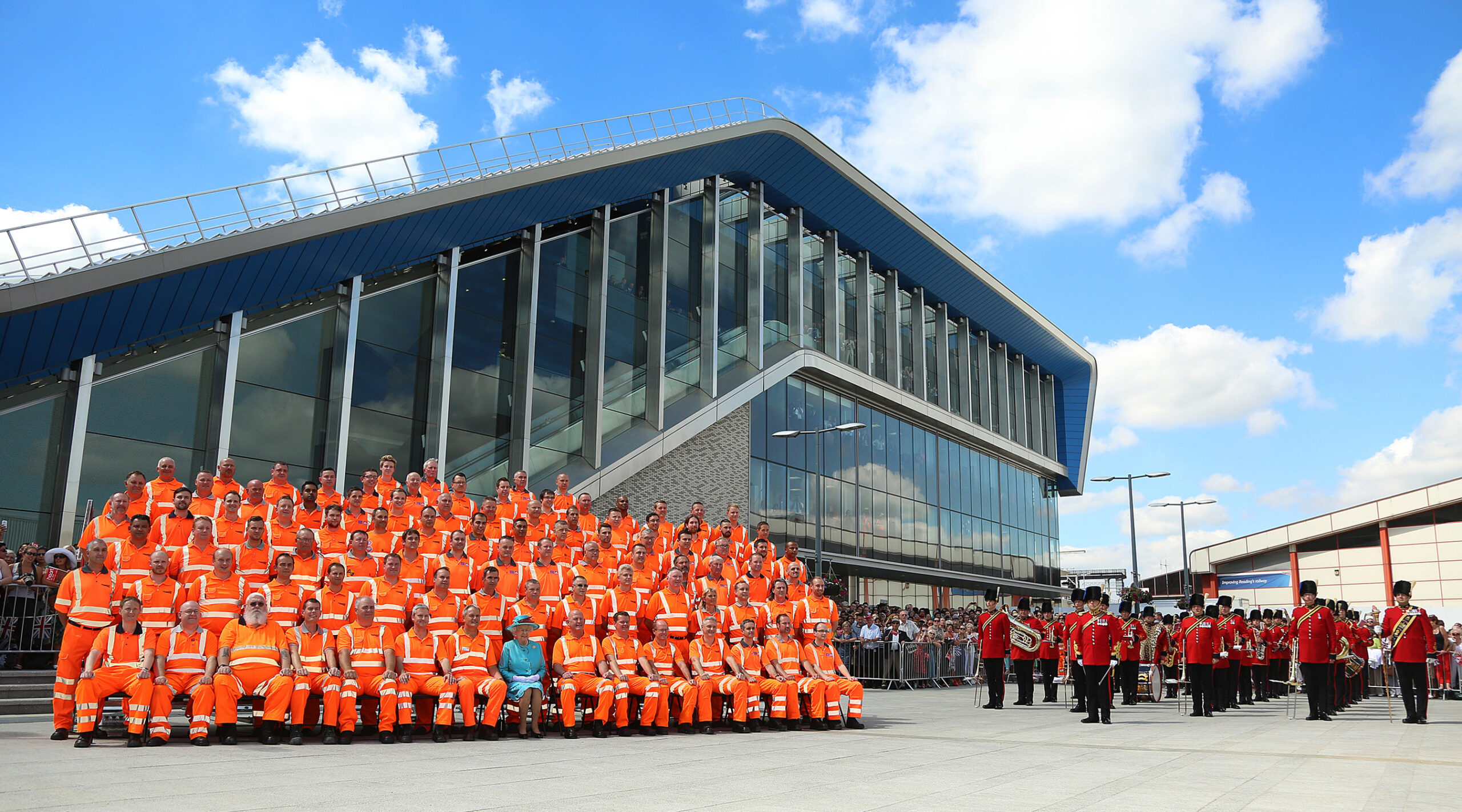 Her Majesty The Queen in special photograph with rail colleagues in front of Reading railway station.