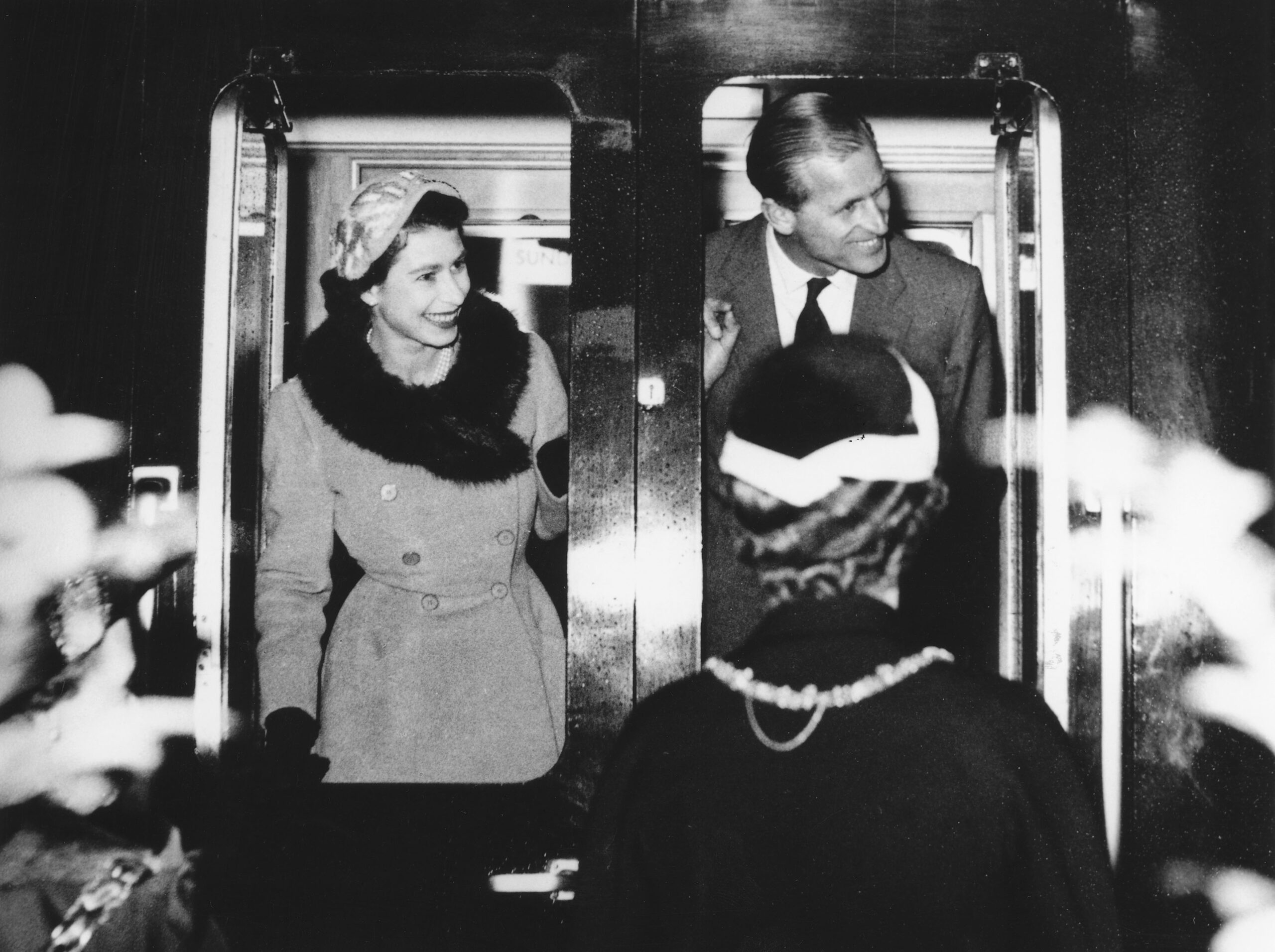 Her Majesty the Queen and His Royal Highness The Duke of Edinburgh on disembarking from their Royal Carriage.