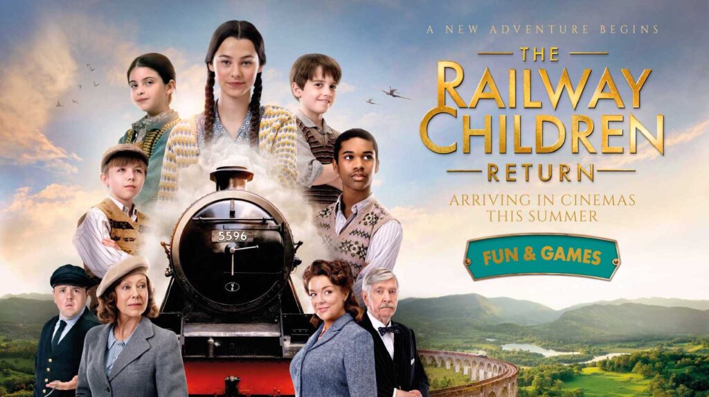 The cast of The Railway Children Return surrounding a steam train with the title of the film to the right.