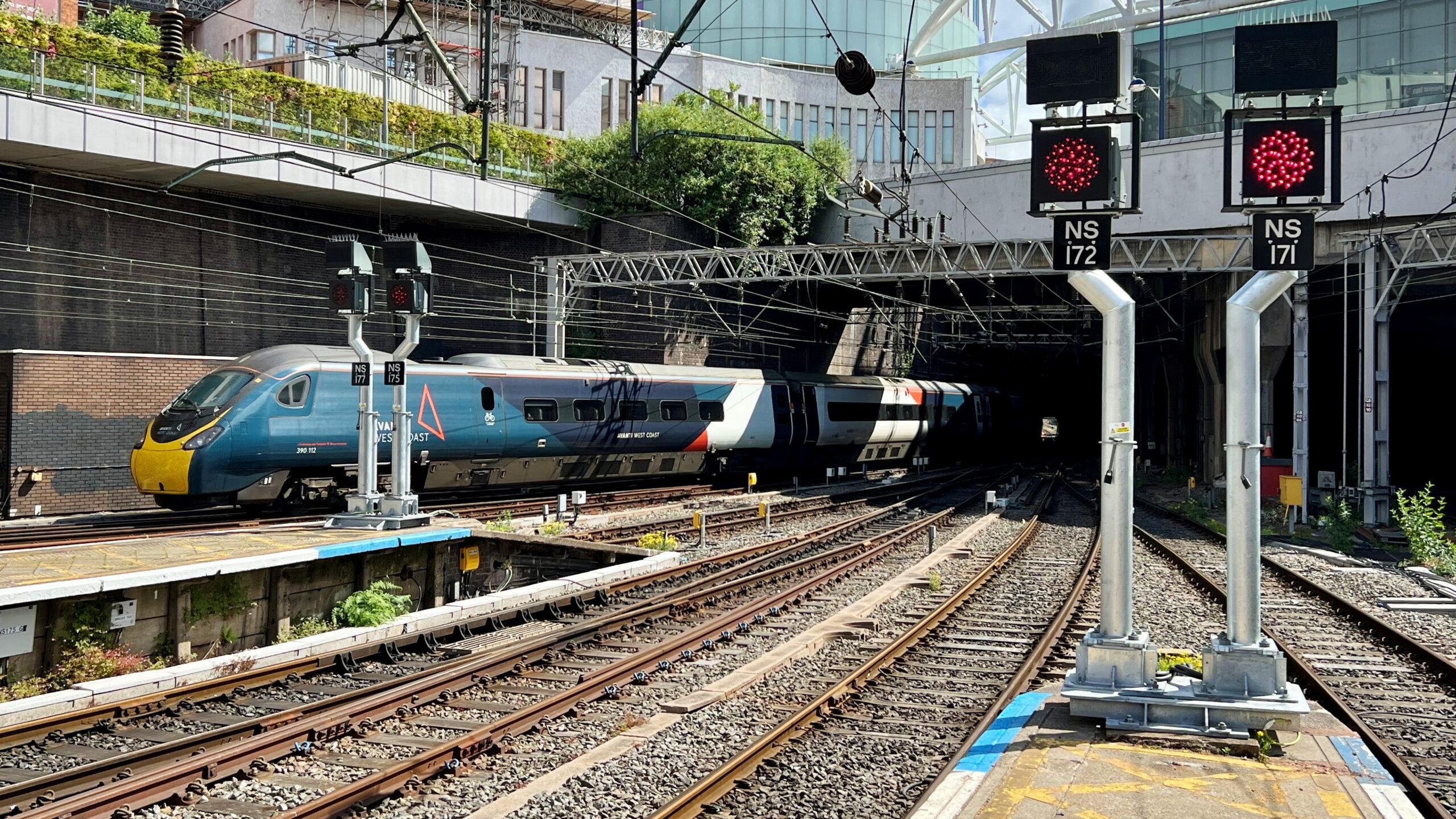 Train arriving past new LED signals at Birmingham New Street. 