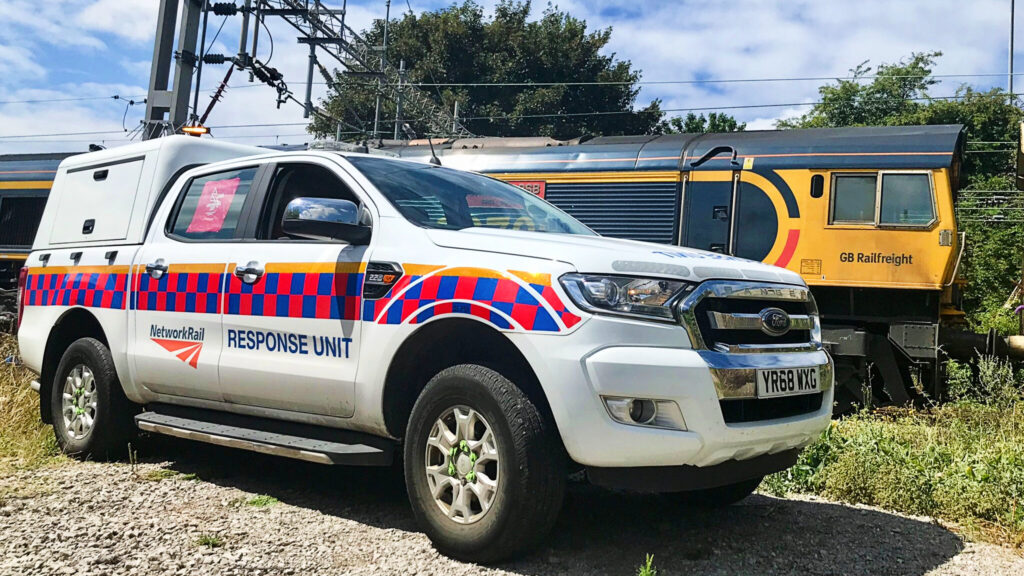 Network Rail Emergency Incident Unit vehicle on standby by railway. 