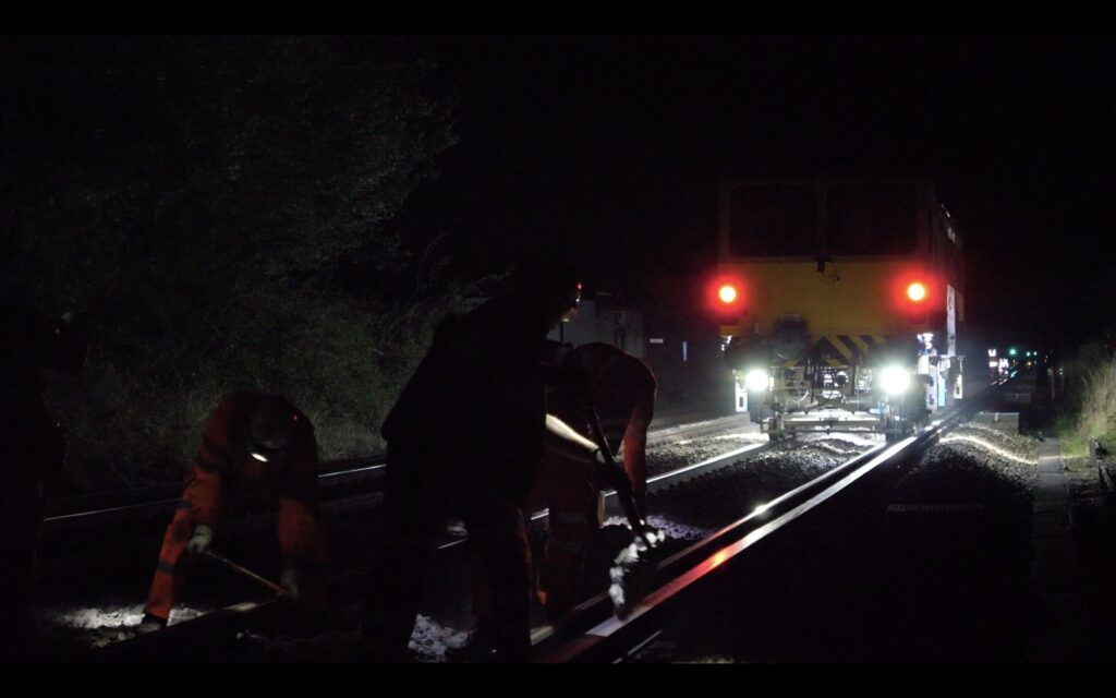 NR engineers realigning track with help of specialised tamper train 