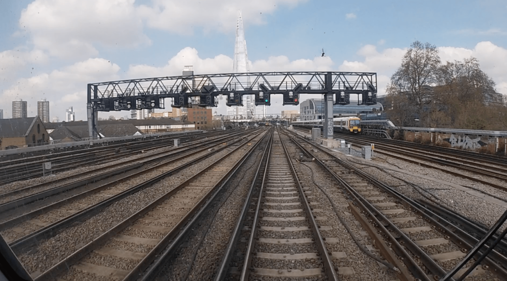 AIVR footage of the approach to London Bridge station with The Shard in the distance.