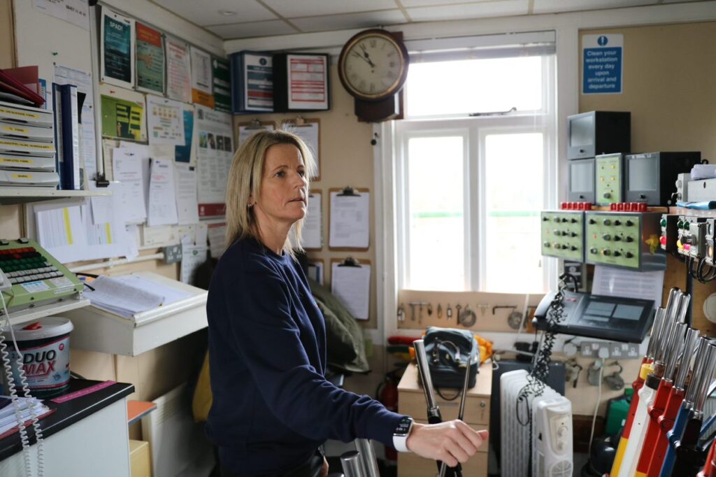Signaller Angela Badrock operating the levers in her signal box.