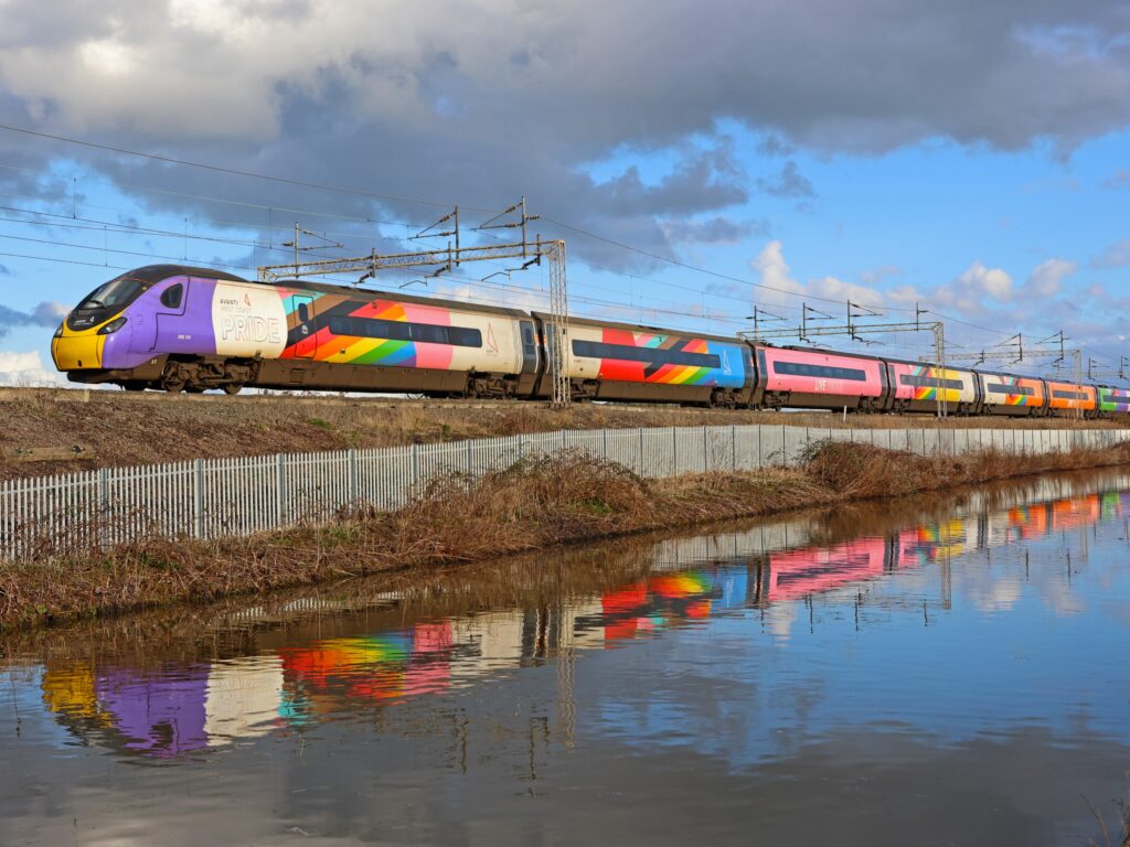 Avanti West Coast's Pride liveried Pendolino coasts alongside the Ansty Canal at Shilton in April.