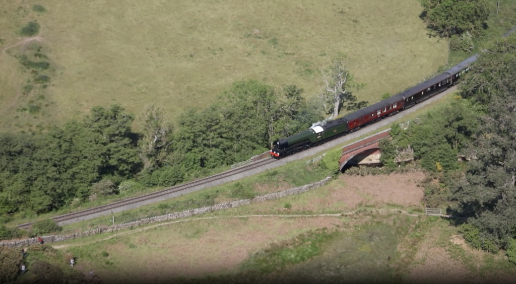 Still from an aerial video of Flying Scotsman pulling the Royal Train.