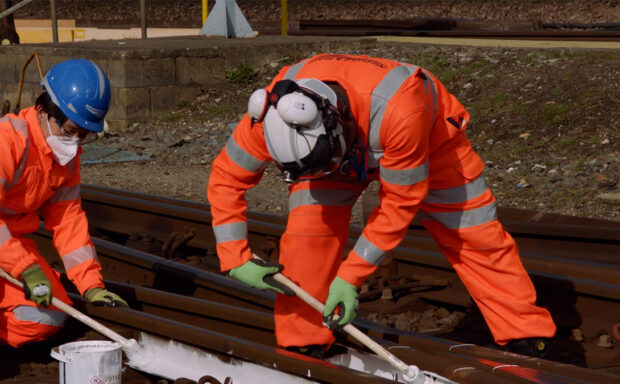 Why does Network Rail paint rails white for the summer?