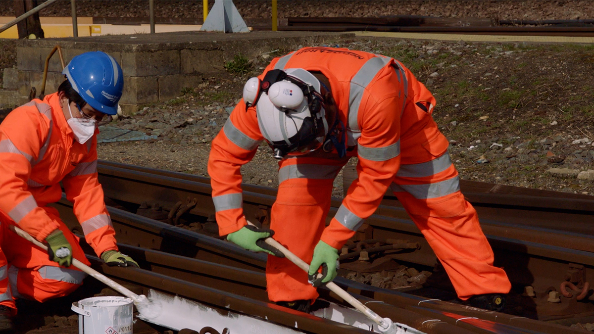 Why does Network Rail paint rails white for the summer?
