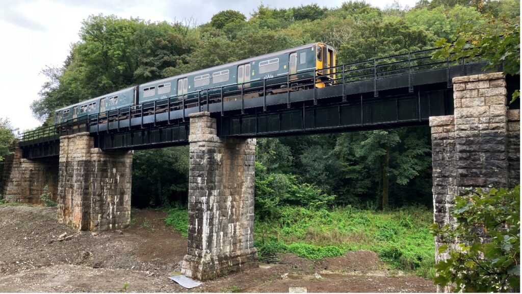 Train travelling over Ponts Mill viaduct
