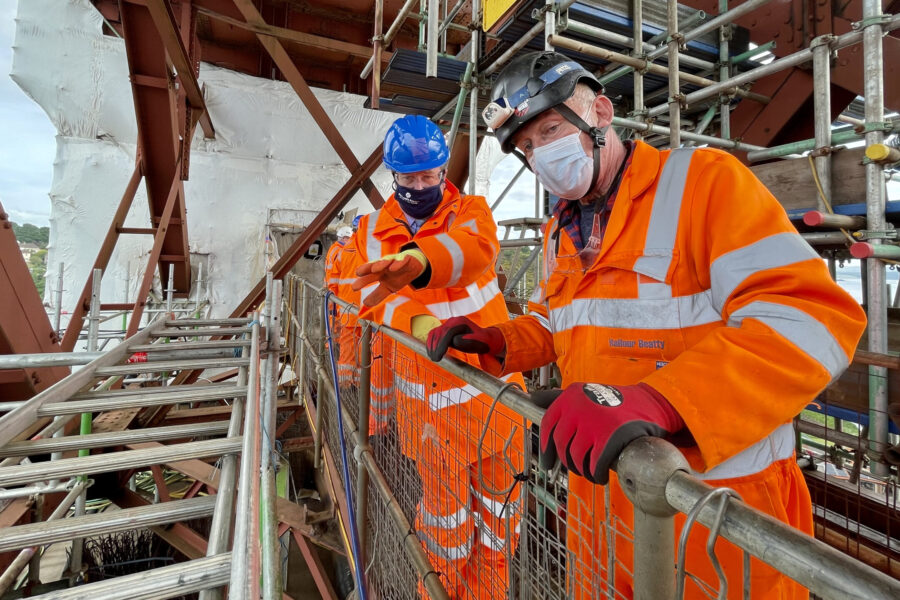 NR engineer showing transport minister scaffolding at Forth Bridge