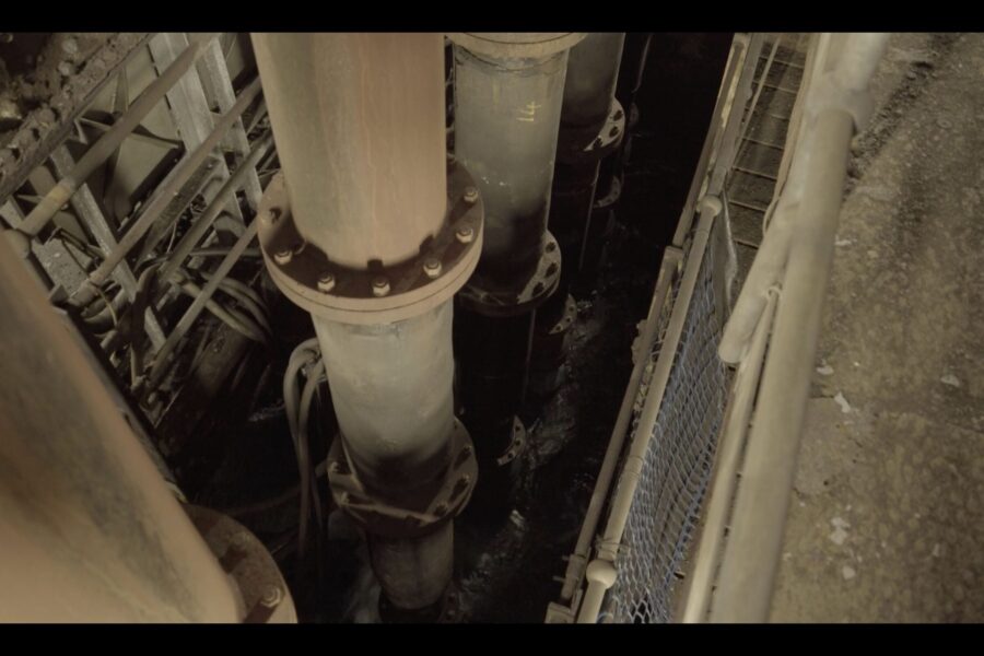 Old pumps and risers at bottom of shaft