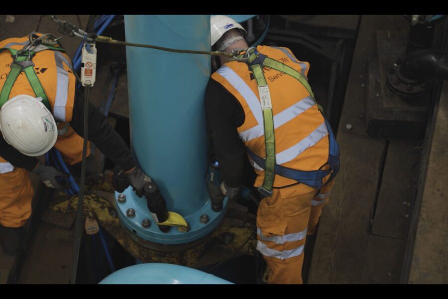 Engineers attaching new risers