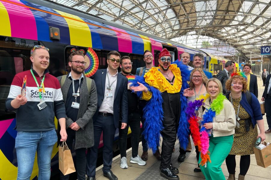 Eurovision superfans getting off specially branded London Northwestern Railway train at Lime Street May 9-min