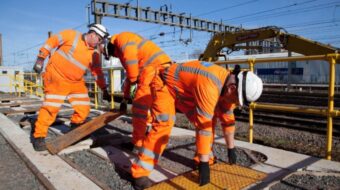Engineers_fitting_new_cables_as_part_of_the_East_Coast_Digital_Programme