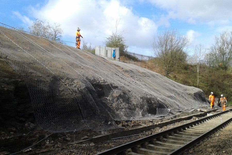 Engineers installing rock netting at Lambhill