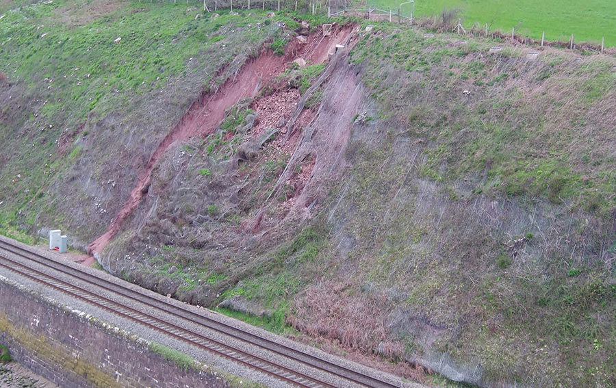 Cutting slope failure contained by meshing preventing encroachment onto the track
