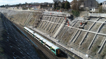 Engineers working on earthworks cutting