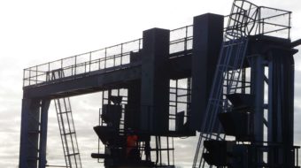 An Engineer on a gantry testing the signals