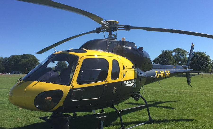 Network Rail helicopter on grass, daytime