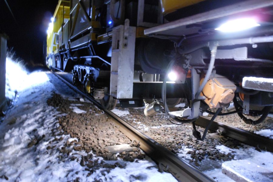 Close up of the bottom of winter development vehicle with snow around the tracks