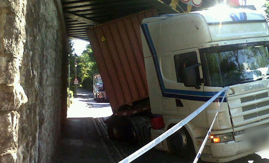A lorry that has got twisted after crashing into a bridge
