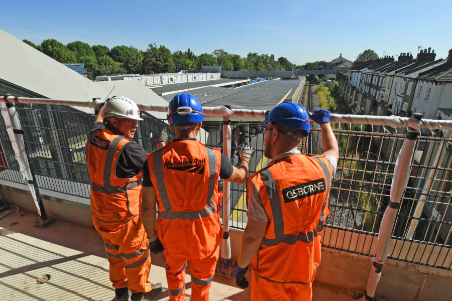 Engineers having team briefing at Twickenham station